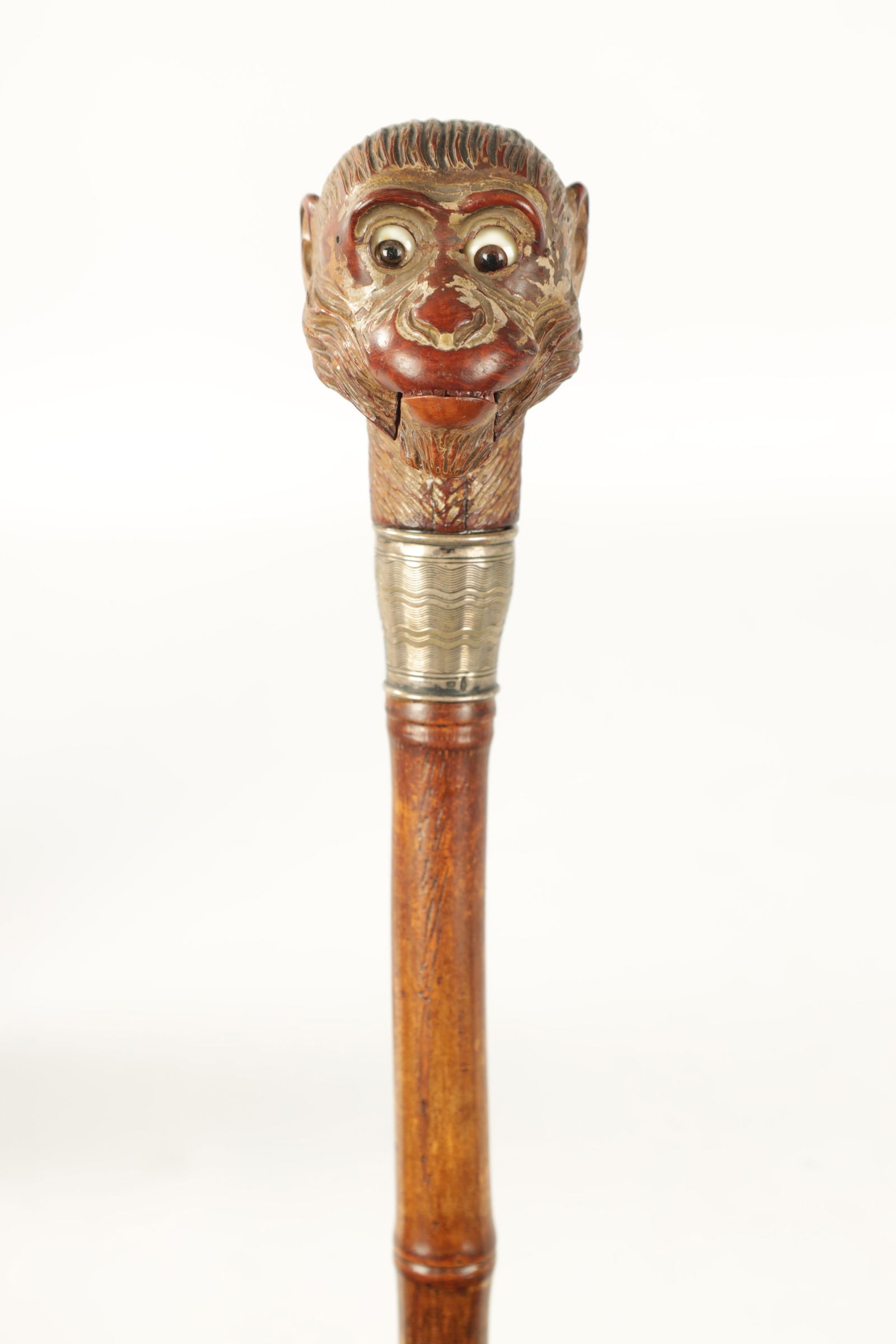 A LATE 19TH CENTURY NOVELTY WALKING STICK FORMED AS A MONKEY HEAD WITH AUTOMATON EYES AND MOUTH (1 of 9)