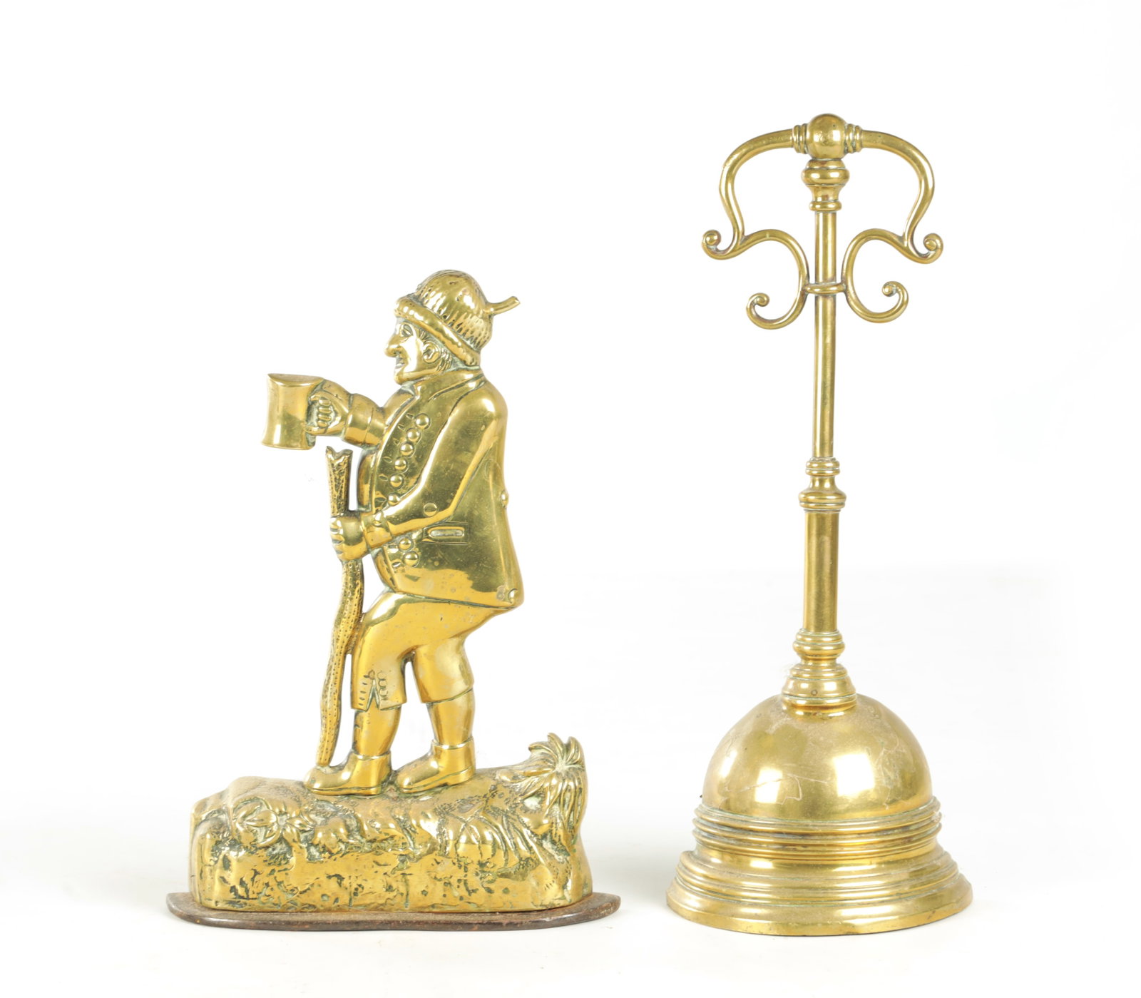 TWO 19TH CENTURY BRASS DOORSTOPS: TWO 19TH CENTURY BRASS DOORSTOPS, one modelled as a country gent with beer and staff, the other with domed base and scroll work handle, both with weighted bases. (2) (35.5cm and smaller)