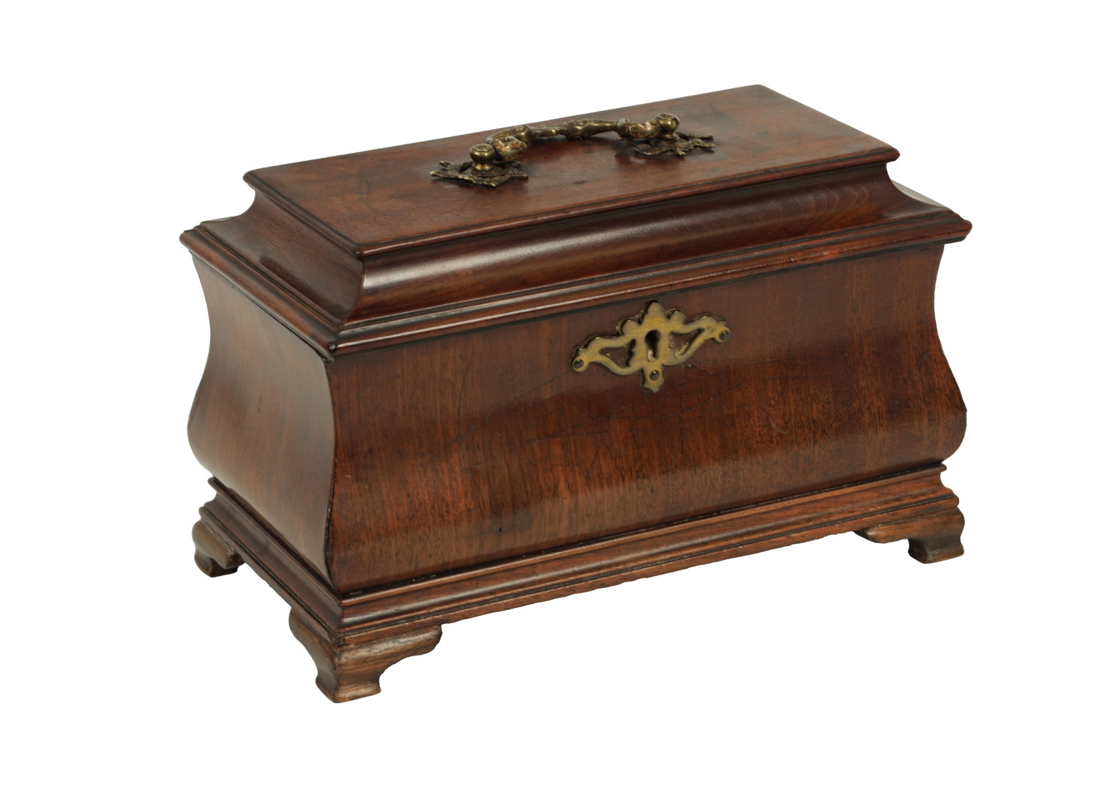 AN UNUSUAL EARLY GEORGE III MAHOGANY TEA CADDY OF OGEE SHAPE: AN UNUSUAL EARLY GEORGE III MAHOGANY TEA CADDY OF OGEE SHAPE the hinged moulded top with folding brass rococo handle and shaped lock escutcheon enclosing a fitted interior of tin caddies and dome top 