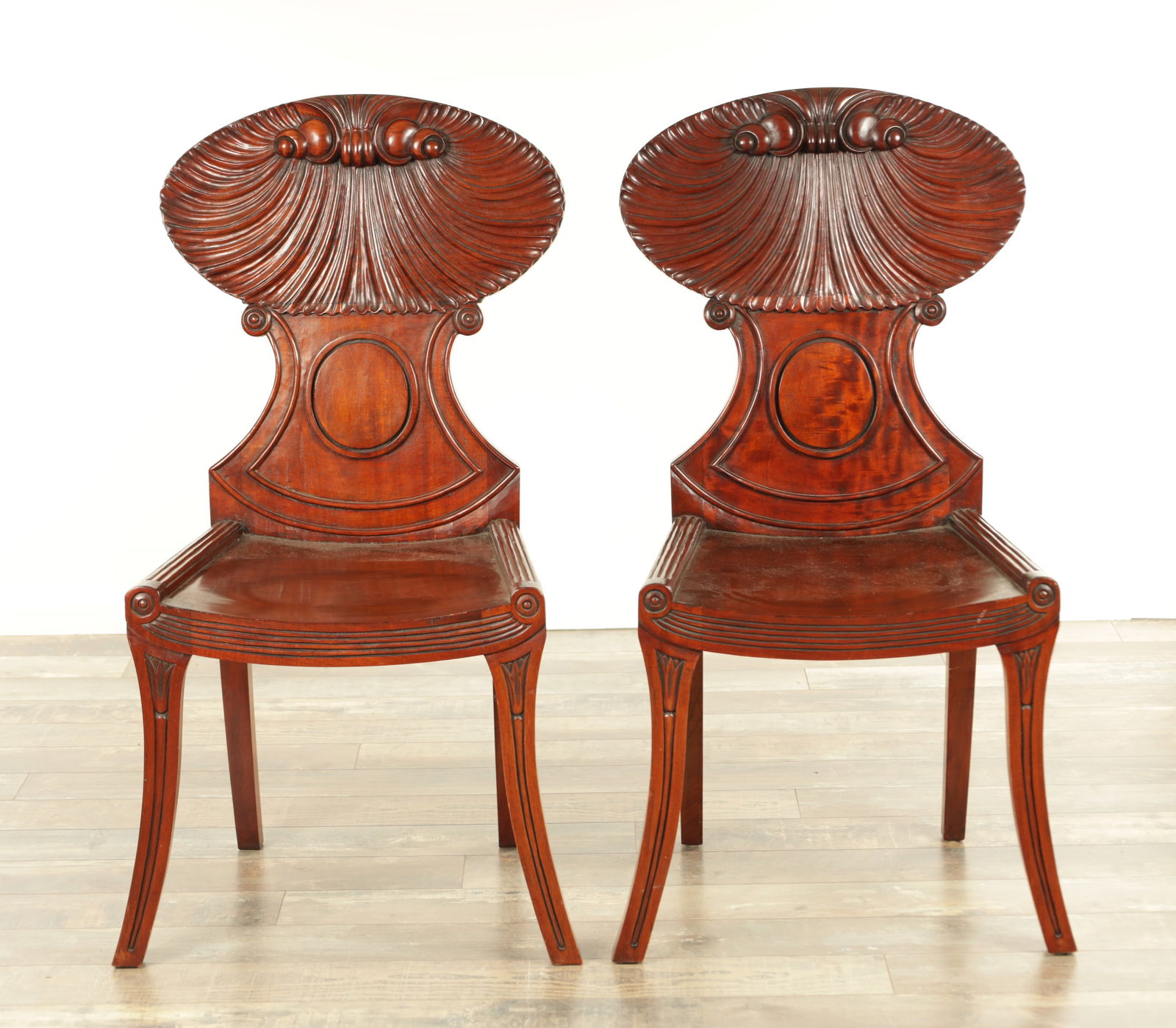 A PAIR OF REGENCY STYLE MAHOGANY HALL CHAIRS (1 of 11)