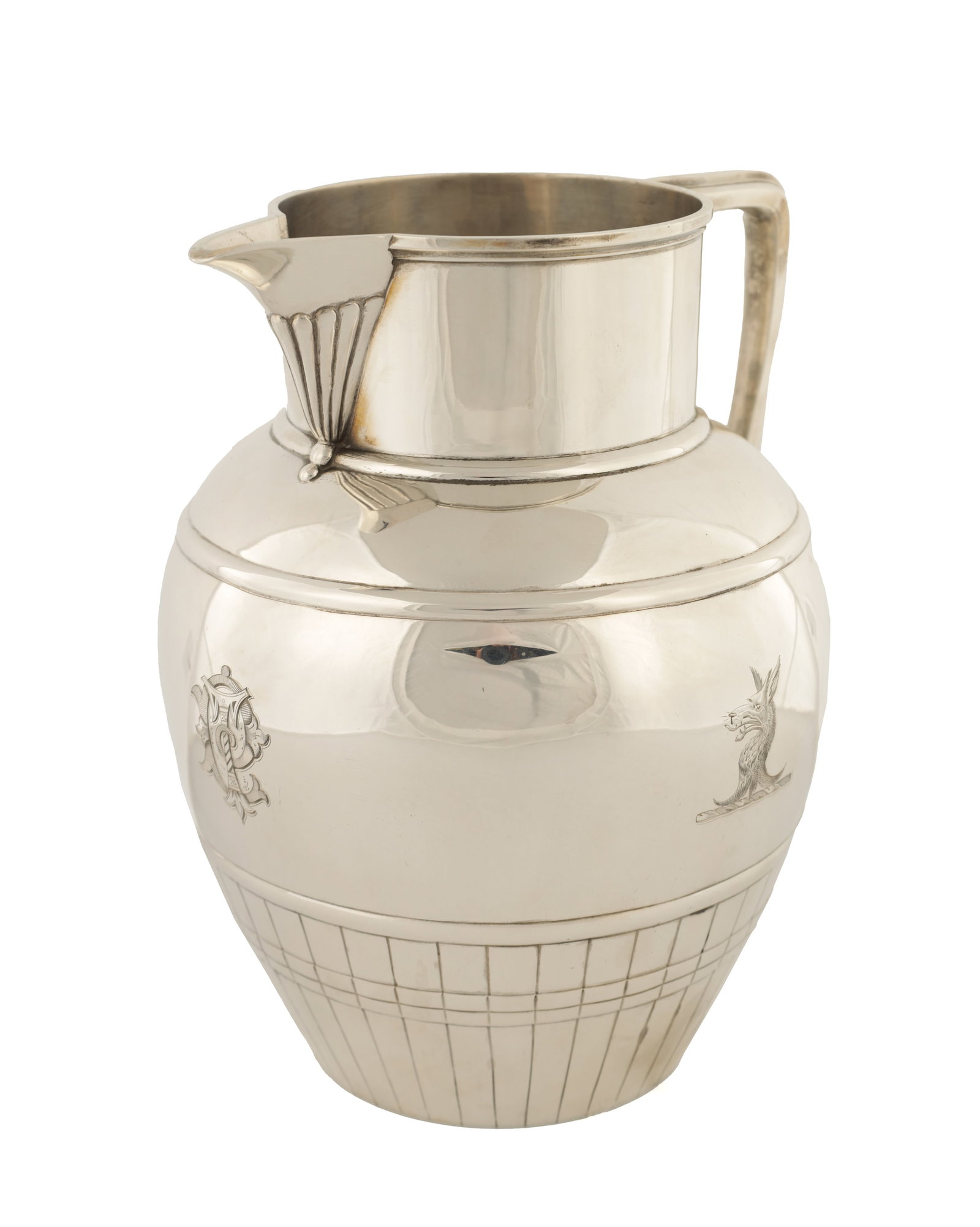 A VICTORIAN SILVER ALE JUG: A VICTORIAN SILVER ALE JUG of half barrel design with acanthus leaf cast angular handle, ribbed beak and engraved cartouche to the shouldered body, London, 1884, by Charles Stuart Harris, 880 grams.