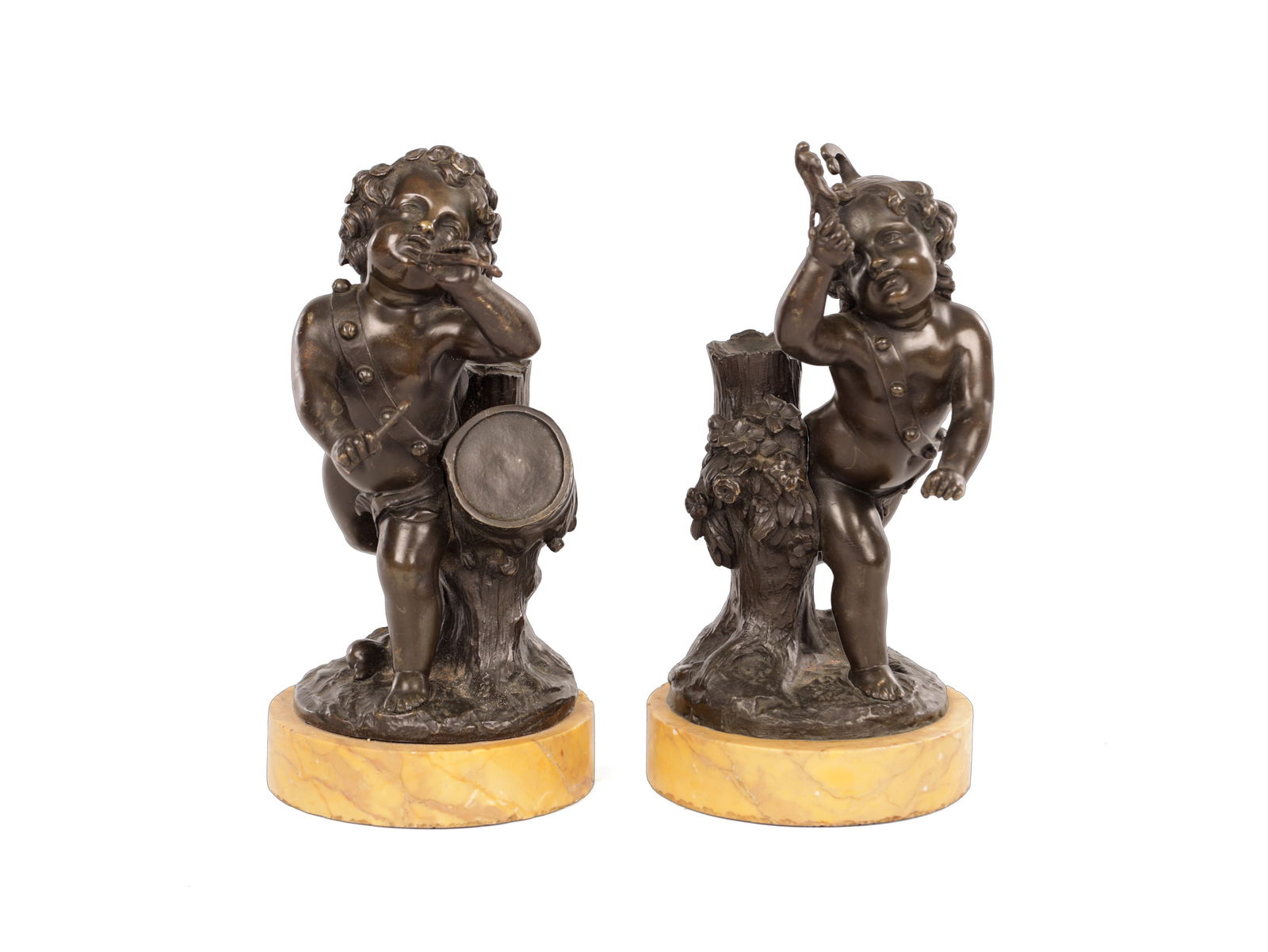 A PAIR OF 19TH CENTURY BRONZE CHERUBS AFTER COLIDON: A PAIR OF 19TH CENTURY BRONZE CHERUBS AFTER COLIDON dancing and playing drums - mounted on sienna marble bases. (22cm high)