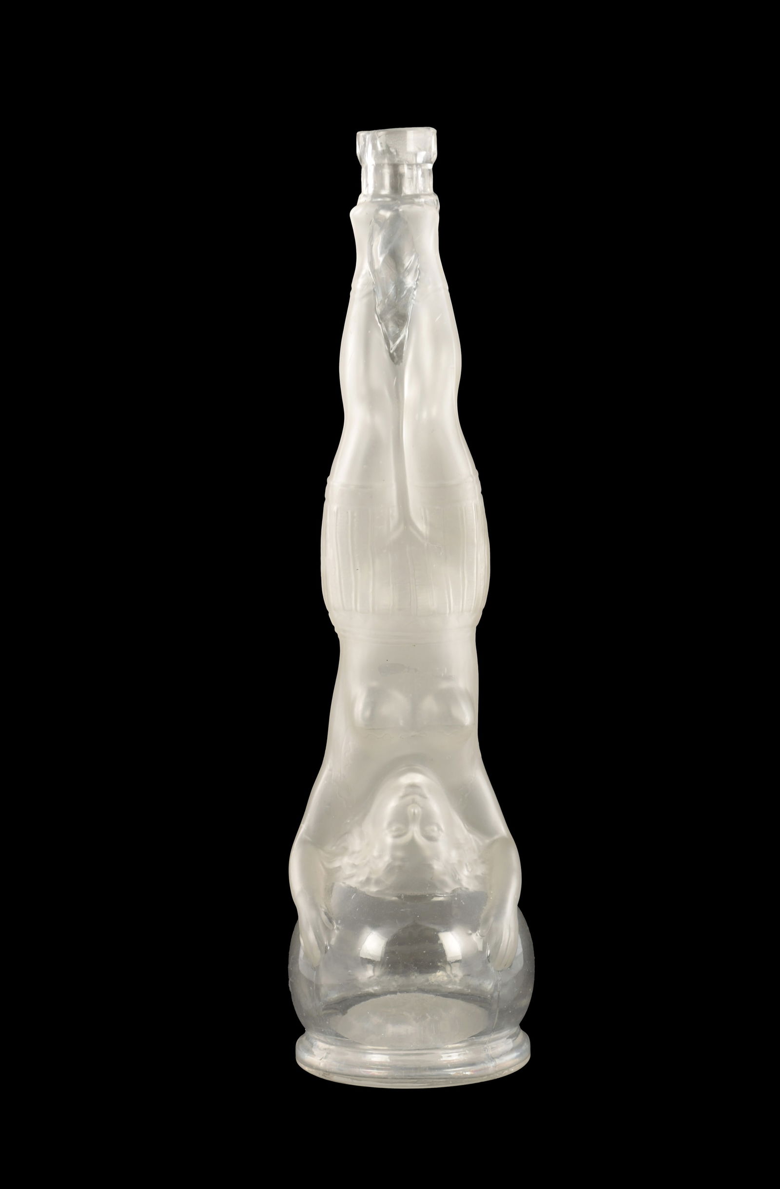 A 19TH CENTURY FRENCH FROSTED AND CLEAR GLASS SOAP BOTTLE BY LEGRAS & CIE: A 19TH CENTURY FRENCH FROSTED AND CLEAR GLASS SOAP BOTTLE BY LEGRAS & CIE moulded as an acrobat in a headstand pose, mouled depose on reverse. (33.5cm high)