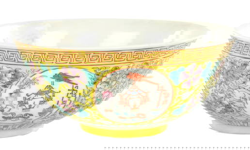 A CHINESE IMPERIAL QING DYNASTY GUANXU PERIOD YELLOW GLAZE BOWL: A CHINESE IMPERIAL QING DYNASTY GUANXU PERIOD YELLOW GLAZE BOWL decorated with garden scene medallions on a yellow ground, the interior with iron red Pheonix. (17cm diameter)