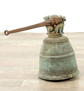 A 19TH CENTURY ORIENTAL BRONZE BELL: A 19TH CENTURY ORIENTAL BRONZE BELL with ringed decoration and seated dragons to the top (39cm high 25cm diameter )