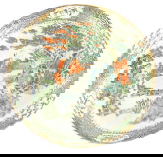 A PAIR OF 19TH CENTURY FAMILLE VERTE PORCELAIN DISHES: A PAIR OF 19TH CENTURY FAMILLE VERTE PORCELAIN DISHES decorated with seated figures in landscape settings surrounded by floral panelled borders (38cm diameter )