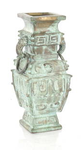 AN EARLY CHINESE CAST BRONZE SQUARE SHAPED VASE: AN EARLY CHINESE CAST BRONZE SQUARE SHAPED VASE with ringed side handles and outset moulded corners with geometric designs (31cm high)