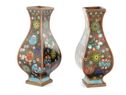 A PAIR OF CHINESE CLOISONNE ENAMEL BULBOUS SQUARE VASES WITH FLARED NECKS: A PAIR OF CHINESE CLOISONNE ENAMEL BULBOUS SQUARE VASES WITH FLARED NECKS the bodies colourfully decorated with stylised leaf work medallions with butterflies on black scrollwork grounds. (21.5cm high