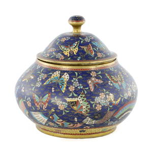 A CHINESE CLOISONNE ENAMEL SQUAT BULBOUS BOWL AND COVER: A CHINESE CLOISONNE ENAMEL SQUAT BULBOUS BOWL AND COVER the body colourfully decorated with stylised leaf work, butterflies and fans, on cobalt blue ground, with matching domed lid and pommel finial.