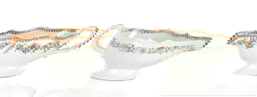 A PAIR OF CHINESE PORCELAIN ROSE PATTERN SAUCE BOATS: A PAIR OF CHINESE PORCELAIN ROSE PATTERN SAUCE BOATS of shaped form with side handles and gilt decoration (24cm wide 8.5cm high )