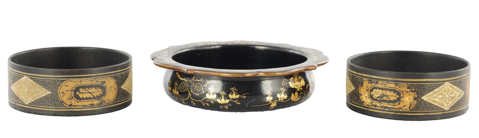 A PAIR AND A SINGLE REGENCY PAPIER MACHE WINE BOTTLE COASTERS: A PAIR AND A SINGLE REGENCY PAPIER MACHE WINE BOTTLE COASTERS with gilt decoration (12cm and 18cm diameter )