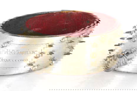 A LARGE VICTORIAN NICKEL AND BRASS ADJUSTABLE DOG COLLAR: A LARGE VICTORIAN NICKEL AND BRASS ADJUSTABLE DOG COLLAR inscribed H.R. Chandler Cringleford, decorated with studs and lined with red leather liner (20cm diameter )