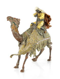 FRANZ BERGMAN. A LATE 19TH CENTURY AUSTRIAN COLD PAINTED BRONZE SCULPTURE: FRANZ BERGMAN. A LATE 19TH CENTURY AUSTRIAN COLD PAINTED BRONZE SCULPTURE, modelled as a camel and Arab being attacked by a lion, impressed maker's mark to leg. (17cm high)