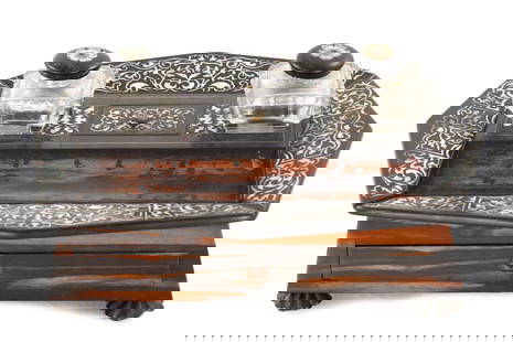 A 19TH CENTURY ROSEWOOD AND MOTHER OF PEARL INLAID DESK TIDY: A 19TH CENTURY ROSEWOOD AND MOTHER OF PEARL INLAID DESK TIDY of rectangular tapering form with pointed octagonal rim inlaid with floral designs, the centre with lidded compartment, two cut glass