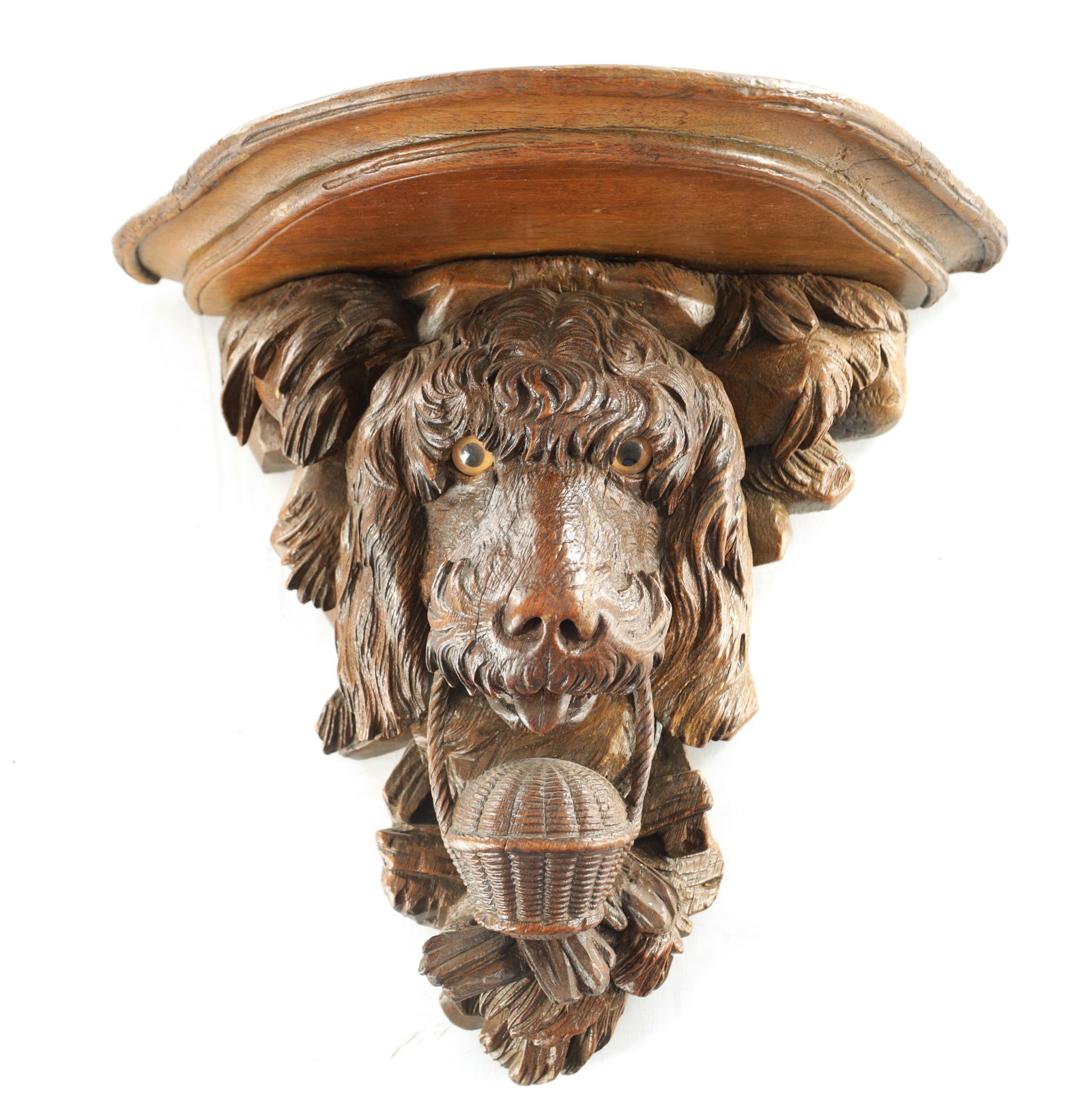A 19TH CENTURY BLACK FOREST CARVED LINDEN WOOD HANGING BRACKET FORMED AS A DOGS HEAD (1 of 8)