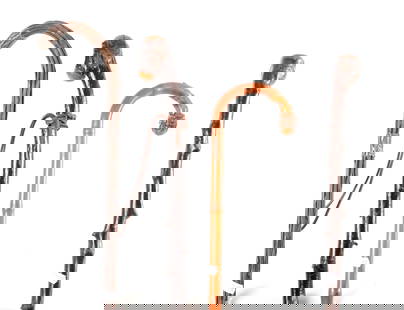 A SELECTION OF FOUR HAWTHRONE AND BAMBOO WALKING STICKS: A SELECTION OF FOUR HAWTHRONE AND BAMBOO WALKING STICKS one with silver mounts. (91cm overall and smaller )