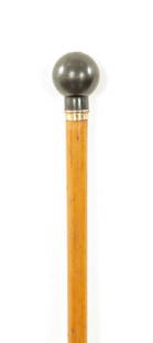 A 19TH CENTURY MALACCA WALKING STICK: A 19TH CENTURY MALACCA WALKING STICK with a metal pommel handle decorated with an encrusted floral design. (87cm long)