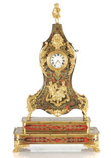 A 19TH CENTURY BOULLE TORTOISESHELL WATCH STAND AND POCKET WATCH: A 19TH CENTURY BOULLE TORTOISESHELL WATCH STAND AND POCKET WATCH, the ormolu mounted case with hinged locking pediment raised on a two-tier plinth base with lions claw feet, the silver open faced watc