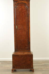 JOHN EVERELL, LONDON. A GOOD EARLY 18TH CENTURY BURR WALNUT EIGHT-DAY BRASS DIAL LONGCASE CLOCK: JOHN EVERELL, LONDON. A GOOD EARLY 18TH CENTURY BURR WALNUT EIGHT-DAY BRASS DIAL LONGCASE CLOCK the 12" arched brass dial with mask head spandrels and Roman chapter ring enclosing a matted centre with