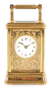 A LATE 19TH CENTURY FRENCH GILT BRASS STRIKING CARRIAGE CLOCK OF SMALL SIZE: A LATE 19TH CENTURY FRENCH GILT BRASS STRIKING CARRIAGE CLOCK OF SMALL SIZE the filigree masked dial with enamel Arabic centre fronting an eight-day spring-driven movement with compensated lever escap