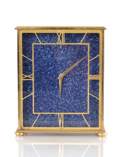 JAEGER-LECOULTRE. A SWISS MID 20TH CENTURY GILT BRASS AND FAUX LAPIS LAZULI MANTEL CLOCK: JAEGER-LECOULTRE. A SWISS MID 20TH CENTURY GILT BRASS AND FAUX LAPIS LAZULI MANTEL CLOCK of rectangular form having inset glass panel with applied gilt Roman chapter ring enclosing a faux Lapis dial f