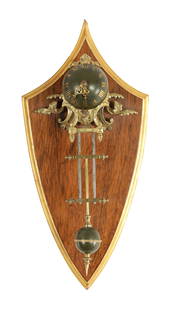 A LATE 19TH CENTURY FRENCH SWINGING MYSTERY WALL CLOCK: A LATE 19TH CENTURY FRENCH SWINGING MYSTERY WALL CLOCK, the gridiron type pendulum with ormolu mounts and spherical case having applied Roman numerals fronting an eight day spring driven movement, sus