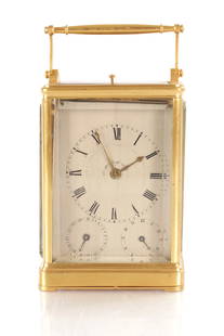 BERROLLA, A PARIS. A MID 19TH CENTURY GILT BRASS QUARTER STRIKING CARRIAGE CLOCK WITH CALENDAR: BERROLLA, A PARIS. A MID 19TH CENTURY GILT BRASS QUARTER STRIKING CARRIAGE CLOCK WITH CALENDAR with turned hinged handle and gilt brass case inset with thick bevelled glass panels and shuttered back