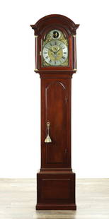 DANIEL TRIBE, PORTSMOUTH POINT. A MID 18TH CENTURY MAHOGANY EIGHT-DAY LONGCASE CLOCK WITH AUTOMATION: DANIEL TRIBE, PORTSMOUTH POINT. A MID 18TH CENTURY MAHOGANY EIGHT-DAY LONGCASE CLOCK WITH AUTOMATION the 12" arched brass dial with four season spandrels and silvered Roman chapter ring enclosing a ma