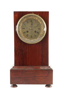 A 19TH CENTURY FRENCH ROSEWOOD MANTEL CLOCK: A 19TH CENTURY FRENCH ROSEWOOD MANTEL CLOCK, of rectangular form with plinth base enclosing a brass dial with Roman numerals fronting an eight-day spring-driven movement striking the hours/half hours