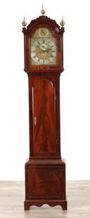 THOMAS HATTON, LONDON. A GEORGE III FIGURED MAHOGANY LONGCASE CLOCK: THOMAS HATTON, LONDON. A GEORGE III FIGURED MAHOGANY LONGCASE CLOCK, the hood with shaped pediment and reeded canted corners, the trunk with moulded door on box base, the 12" arched brass dial with