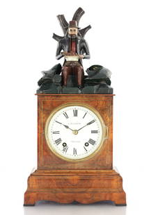 A RARE 19TH CENTURY BLACK FOREST AUTOMATION "DUMPLING EATER" MANTEL CLOCK: A RARE 19TH CENTURY BLACK FOREST AUTOMATION "DUMPLING EATER" MANTEL CLOCK, the figured walnut case with brass string inlay surmounted by a polychrome carried automated figure of a gentleman eating