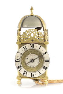 EDWARD NORRIS AT THE CROSS KEYS CATEEATON STREET. A 17TH CENTURY BRASS LANTERN CLOCK WITH BALANCE: EDWARD NORRIS AT THE CROSS KEYS CATEEATON STREET. A 17TH CENTURY BRASS LANTERN CLOCK WITH BALANCE WHEEL ESCAPEMENTthe 6_" silvered Roman chapter ring with wheat-ear half-hour markers and inner quarter