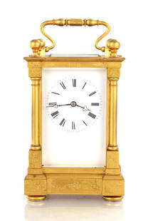 VALOGNE A PARIS. A FRENCH 19TH CENTURY GILT BRASS STRIKING CARRIAGE CLOCK: VALOGNE A PARIS. A FRENCH 19TH CENTURY GILT BRASS STRIKING CARRIAGE CLOCK, the engraved case having ball finials, turned corner columns and shuttered back door enclosing a white enamel dial with Roman
