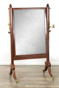 A LATE GEORGIAN MAHOGANY CHEVAL MIRROR: A LATE GEORGIAN MAHOGANY CHEVAL MIRROR with adjustable candelabra and sweeping splayed legs with brass toe casters (93cm wide 160cm high )