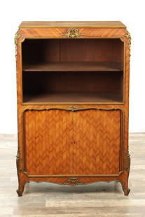 A LATE 19TH CENTURY FRENCH KINGWOOD AND ORMOLU MOUNTED BOOKCASE: A LATE 19TH CENTURY FRENCH KINGWOOD AND ORMOLU MOUNTED BOOKCASE with adjustable shelves above a tambour fronted cupboard base (84cm wide 45cm deep 125cm high )