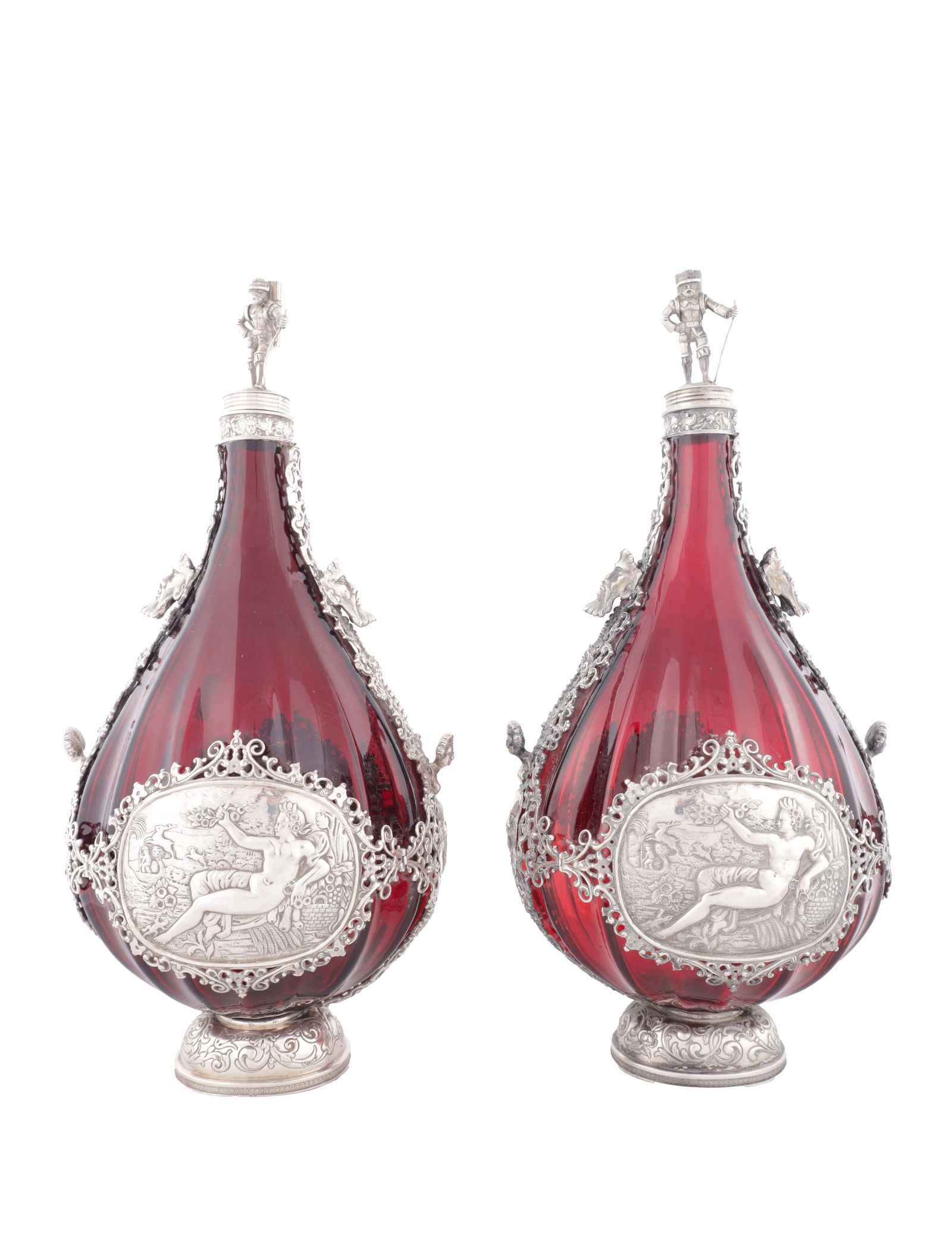 A PAIR OF LATE 19TH CENTURY CONTINENTAL RUBY GLASS PILGRIM FLASKS WITH SILVER MOUNTS: A PAIR OF LATE 19TH CENTURY CONTINENTAL RUBY GLASS PILGRIM FLASKS WITH SILVER MOUNTS of tear-drop form, each with applied silver mounts finely embossed with classical figures and scrollwork, oval meda