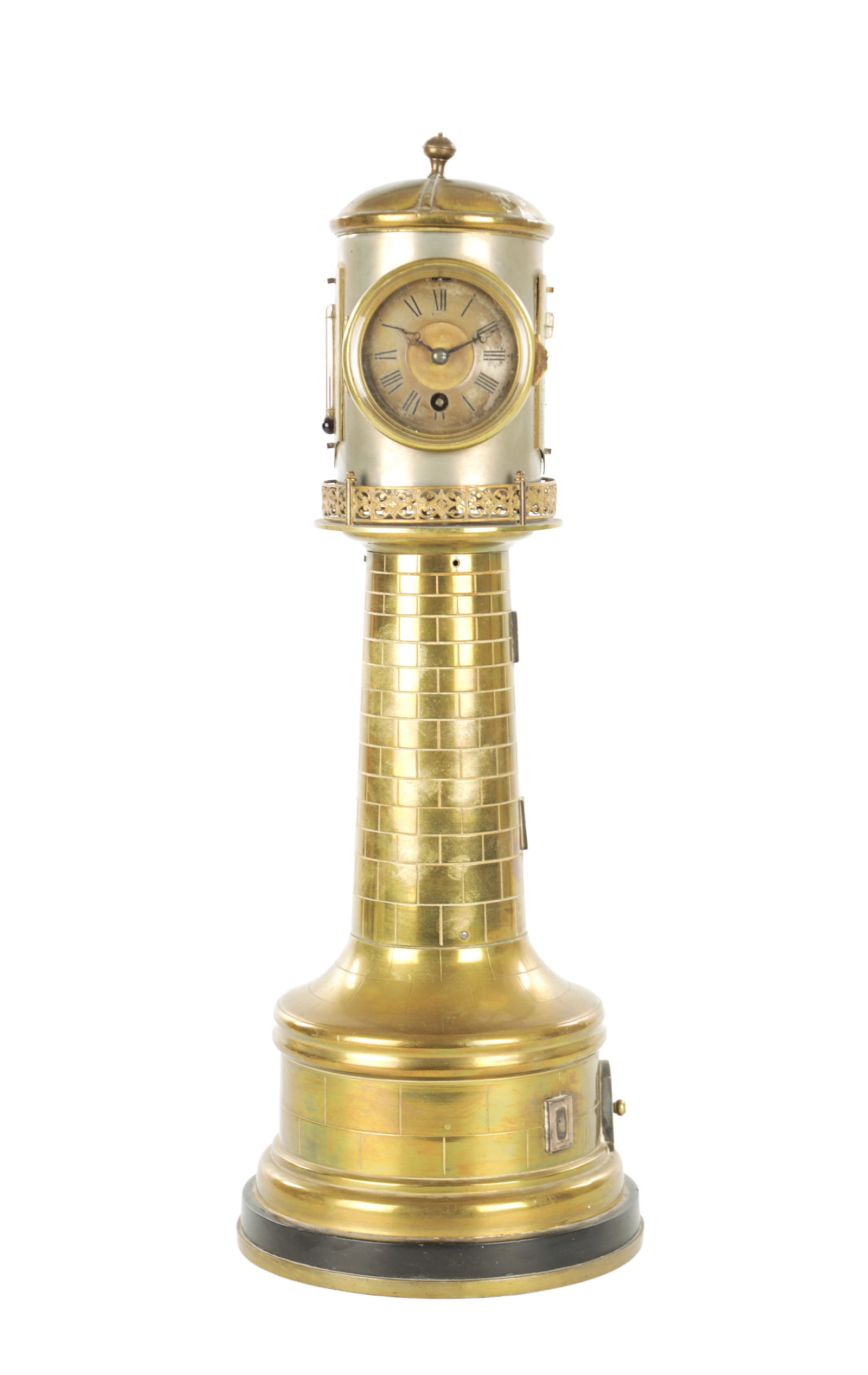 A LATE 19TH CENTURY FRENCH INDUSTRIAL AUTOMATION LIGHTHOUSE CLOCK COMPENDIUM: A LATE 19TH CENTURY FRENCH INDUSTRIAL AUTOMATION LIGHTHOUSE CLOCK COMPENDIUM with clockwork revolving top enclosing an eight-day clock with silvered dial, an aneroid barometer and two thermometer scal