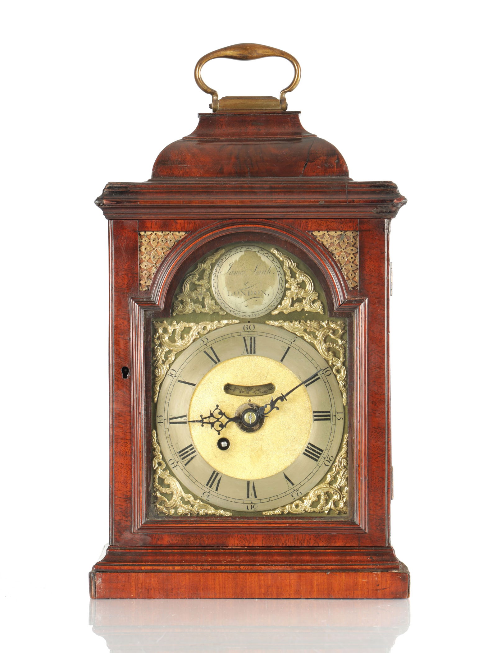 JAMES SMITH, LONDON. A SMALL GEORGE III FIGURED MAHOGANY VERGE BRACKET CLOCK: JAMES SMITH, LONDON. A SMALL GEORGE III FIGURED MAHOGANY VERGE BRACKET CLOCK, the inverted bell top case above a glazed moulded door enclosing a 6" arched brass dial with pierced spandrels and silvere