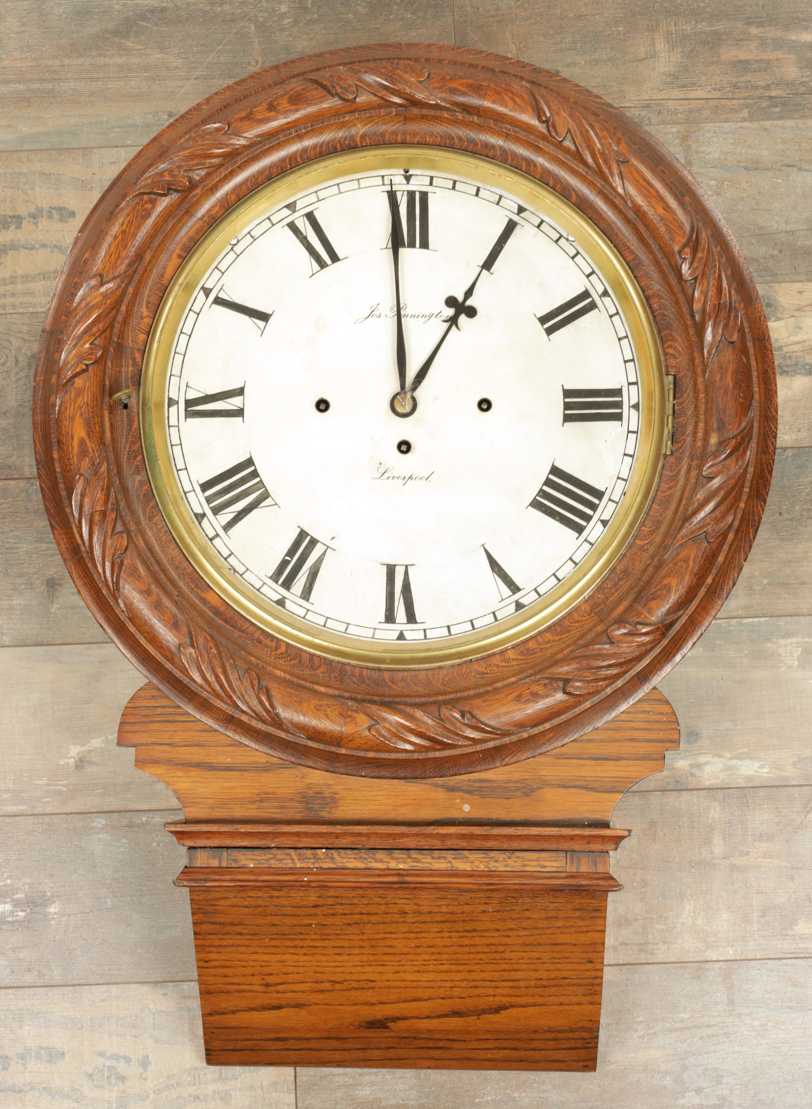 JOSEPH PENNINGTON, LIVERPOOL. A 19TH CENTURY TRIPLE FUSEE DROP DIAL WALL CLOCK: JOSEPH PENNINGTON, LIVERPOOL. A 19TH CENTURY TRIPLE FUSEE DROP DIAL WALL CLOCK, the oak case with chiselled bottom and leaf carved moulded surround enclosing a locking cast bezel and 14" painted dial