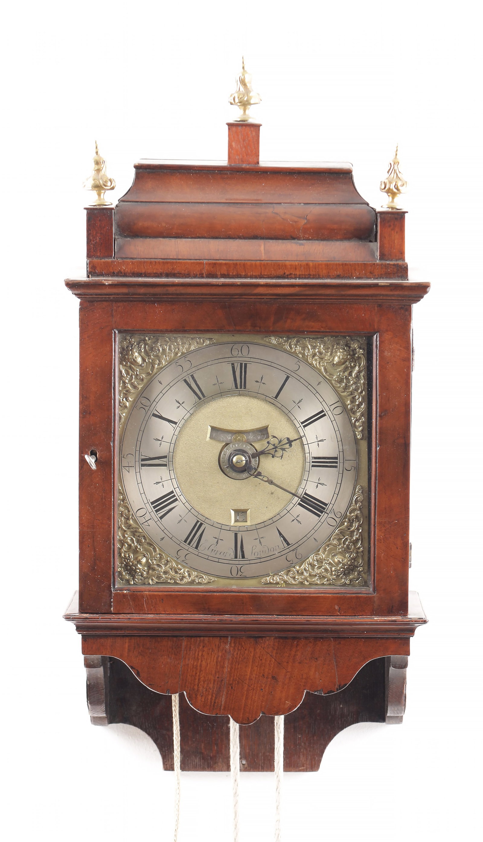 E. GIRARD, LODNON. AN EARLY 18TH CENTURY HOODED WALL CLOCK: E. GIRARD, LODNON. AN EARLY 18TH CENTURY VERGE WALNUT HOODED WALL CLOCK, the hood with inverted bell top pediment and glazed door on a shaped wall mounted bracket enclosing an 8" square brass dial wit