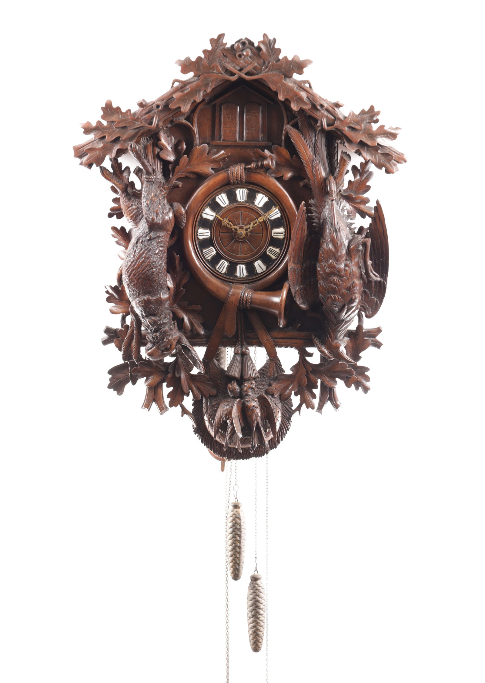 A LARGE LATE 19TH CENTURY MUSICAL BLACK FOREST CUCKOO WALL CLOCK: A LARGE LATE 19TH CENTURY MUSICAL BLACK FOREST CUCKOO WALL CLOCK with a finely carved case having hanging game and hunting horn surrounded by Oak leaves, fronting a weight-driven movement with anchor
