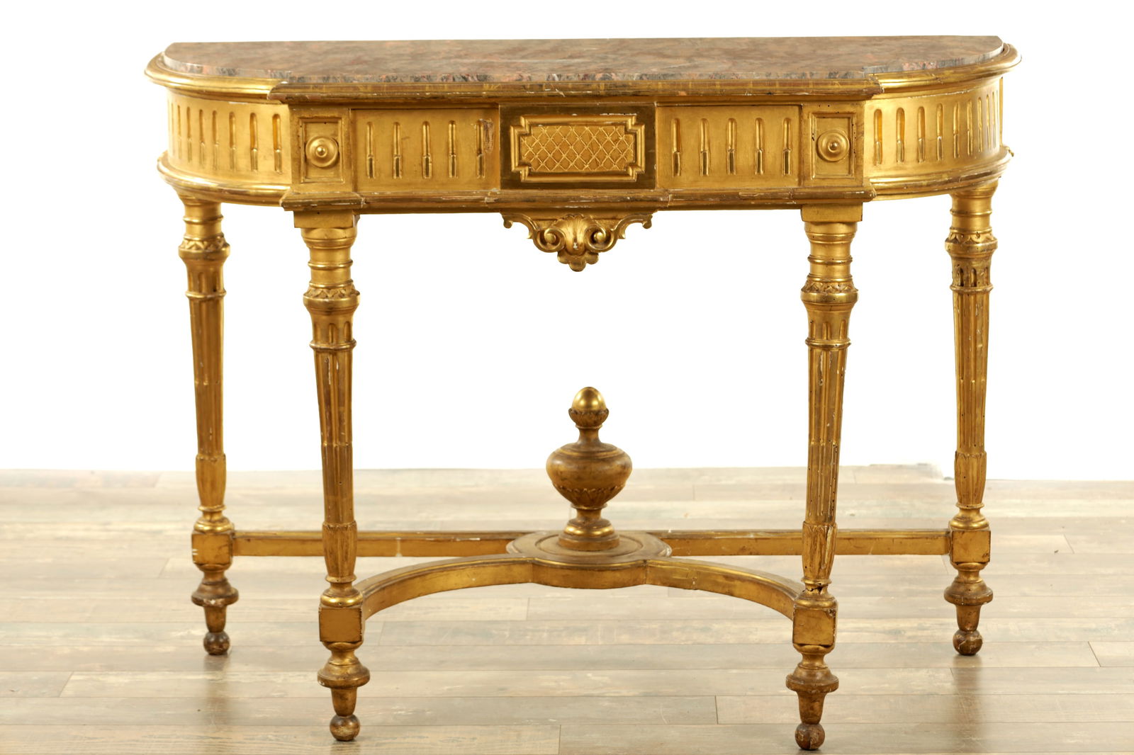 A 19TH CENTURY FRENCH GILT GESSO BOW-FRONTED CONSOLE TABLE: A 19TH CENTURY FRENCH GILT GESSO BOW-FRONTED CONSOLE TABLE with veined coloured marble top above a reeded frieze and raised on stop fluted turned legs joined by a sheped under stretcher (125cm wide 52