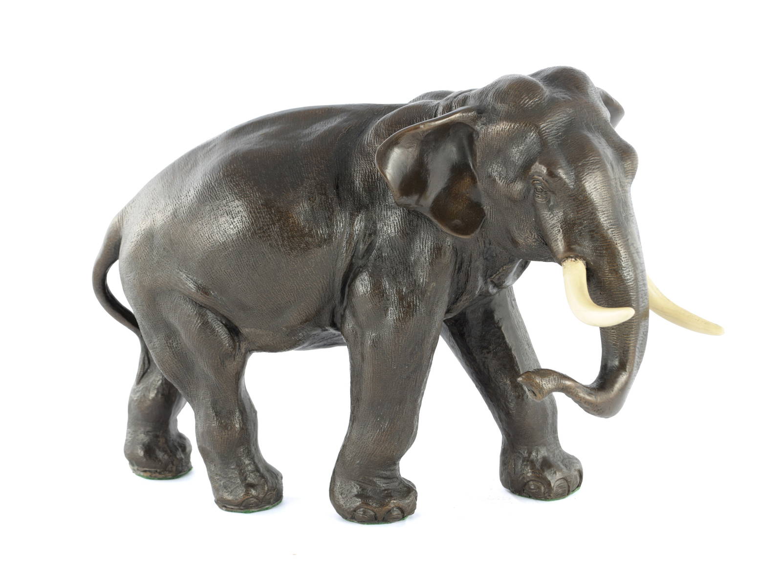 A JAPANESE MEIJI PERIOD FILLED BRONZE SCULPTURE OF AN ELEPHANT