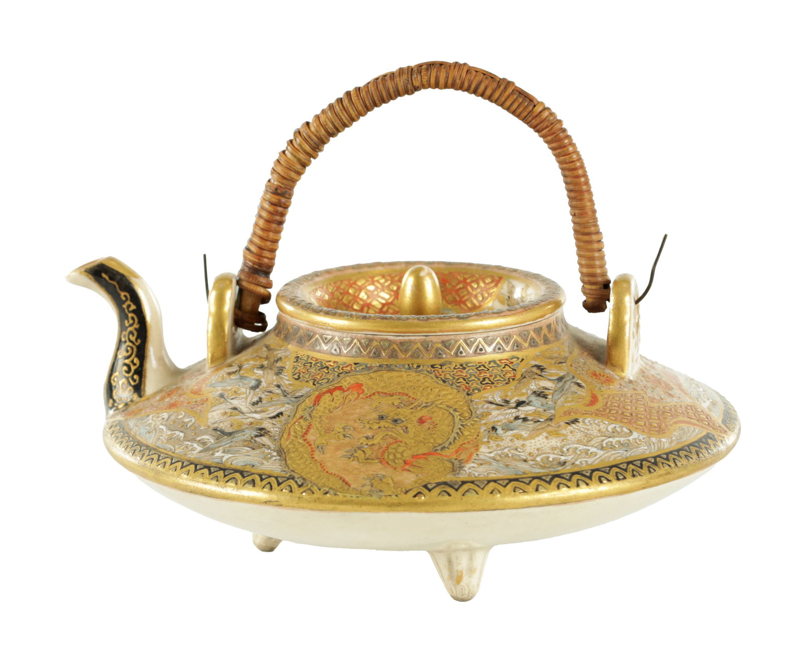 A JAPANESE MEIJI PERIOD SATSUMA TEAPOT: A JAPANESE MEIJI PERIOD SATSUMA TEAPOT finely decorated with gilt dragon motifs - bearing a signature mark beneath (13.5cm across )