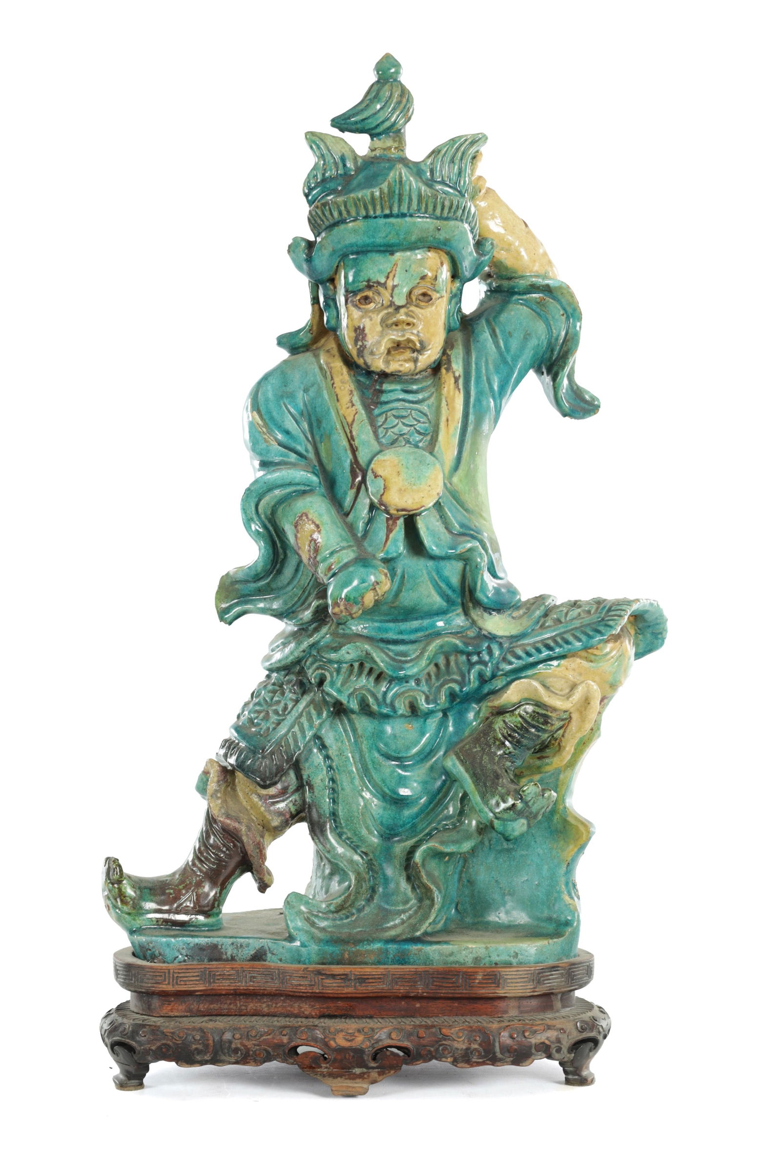 A 19TH CENTURY CHINESE SHIWAN KILN ROOF TILE FIGURE: A 19TH CENTURY CHINESE SHIWAN KILN ROOF TILE FIGURE having turquoise glazed mounted on a 19th century Chinese hardwood stand (depicting a heavenly king) (61cm high overall)