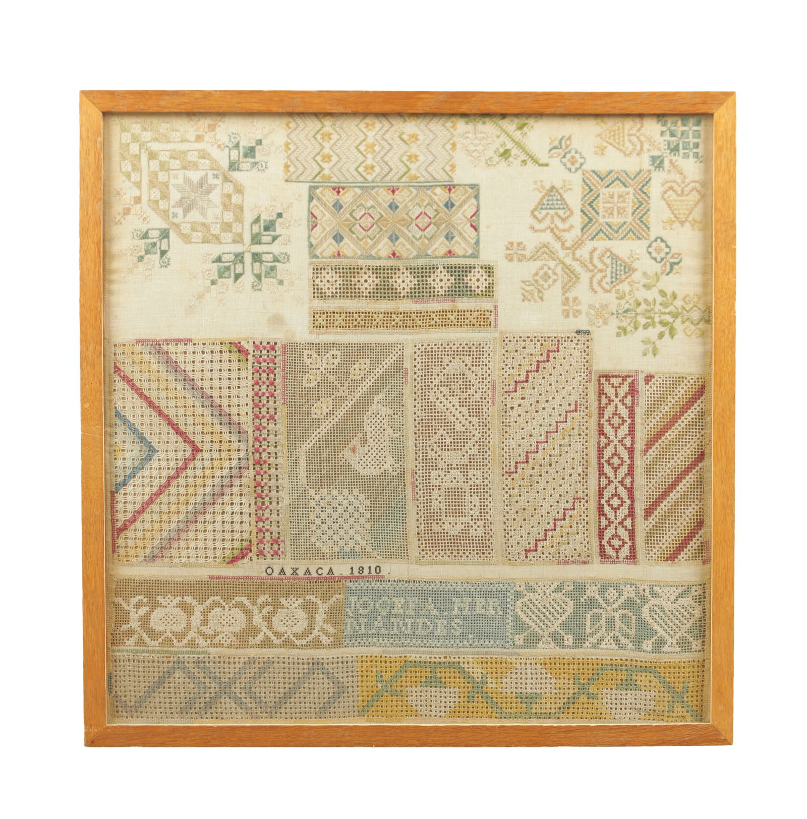 AN EARLY 19TH CENTURY MEXICAN NEEDLEWORK SAMPLER: AN EARLY 19TH CENTURY MEXICAN NEEDLEWORK SAMPLER incorporating colourful silk thread embroidery, drawn thread work and filet work, incorporating fruits, animals, leaves, and geometric designs, on the