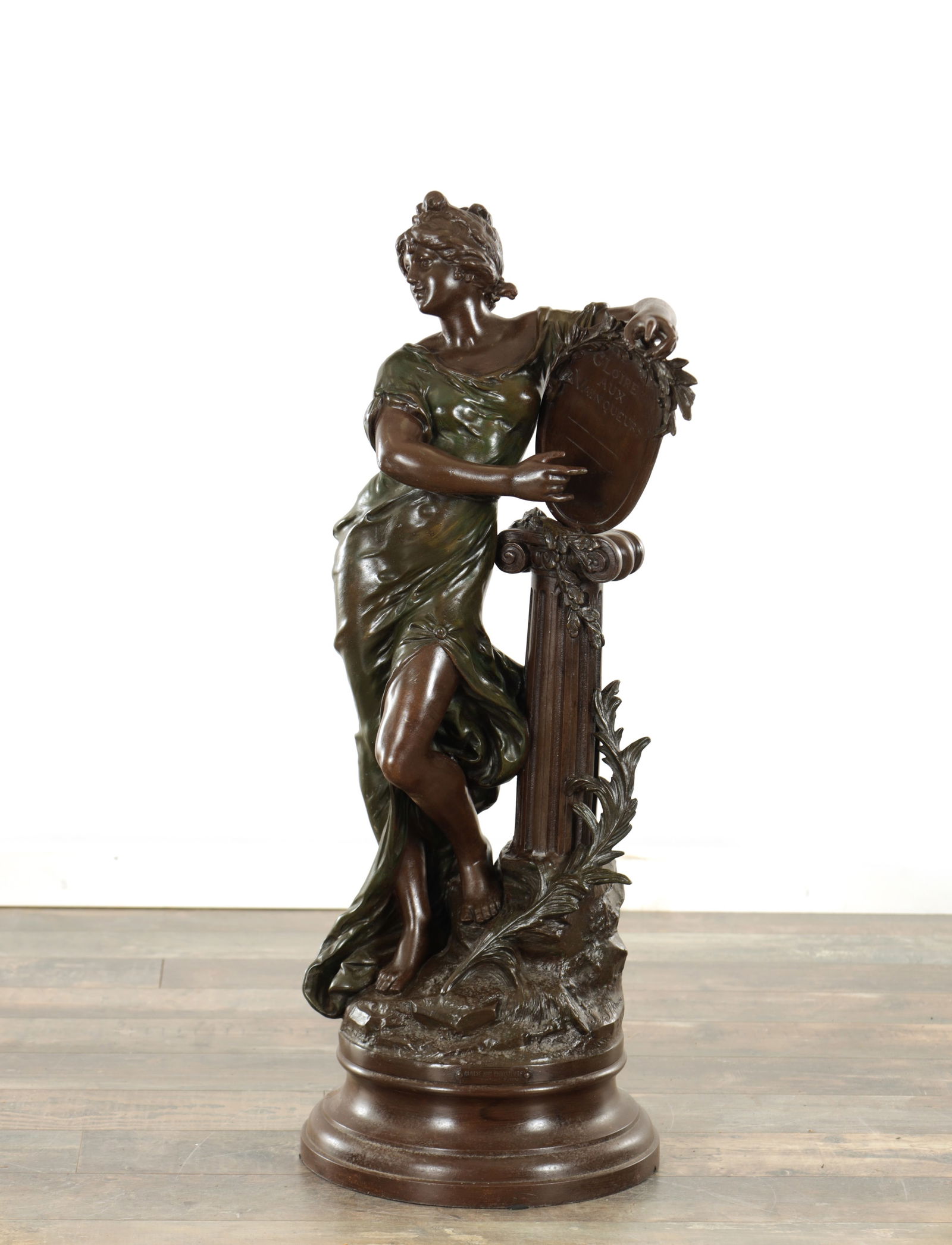 LOUIS AUGUSTE MOREAU (FRENCH 1855 - 1919) A LARGE 19TH CENTURY BRONZED METAL FIGURAL SCULPTURE: LOUIS AUGUSTE MOREAU (FRENCH 1855 - 1919) A LARGE 19TH CENTURY BRONZED METAL FIGURAL SCULPTURE titled " Gloire aux Vainqueurs" and depicting a female figure raised on a naturalistic pedestal base with