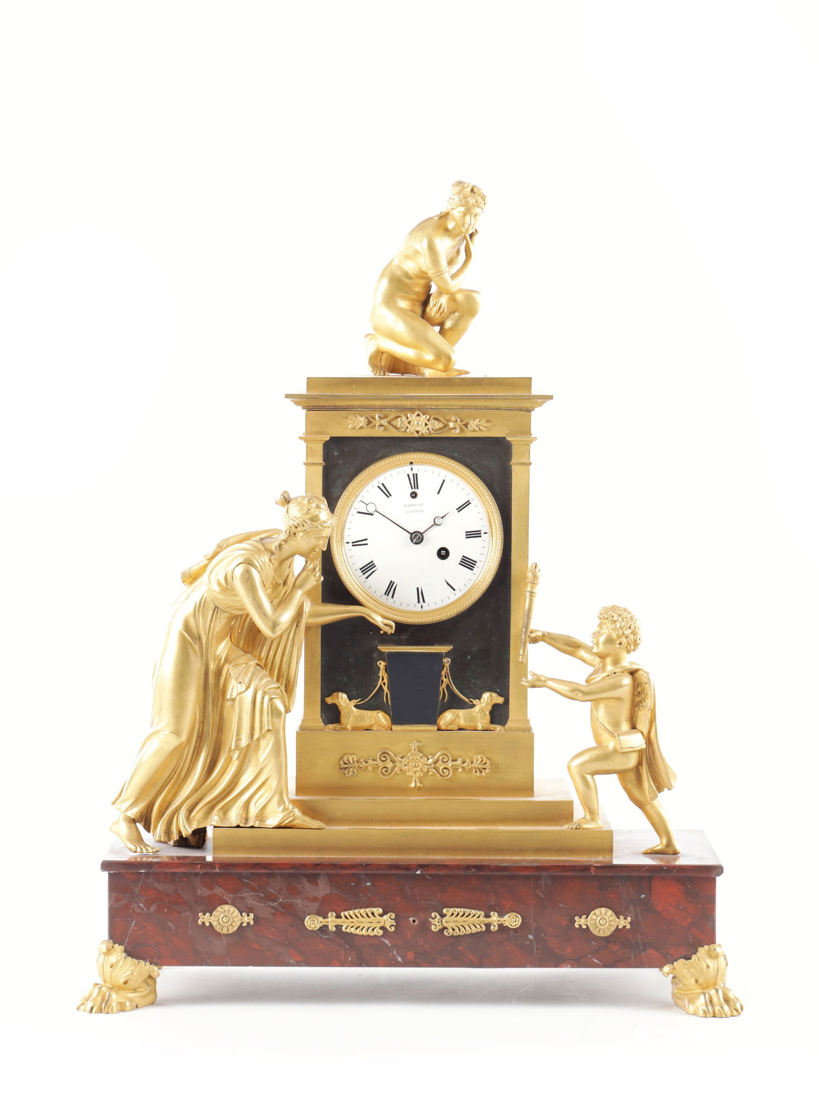 BARWISE, LONDON. AN EARLY 19TH CENTURY REGENCY ORMOLU AND ROUGE MARBLE MANTEL CLOCK: BARWISE, LONDON. AN EARLY 19TH CENTURY REGENCY ORMOLU AND ROUGE MARBLE MANTEL CLOCK with crouching Venus surmount above a gilt and bronze case with mounted figures and raised on a rouge marble plinth