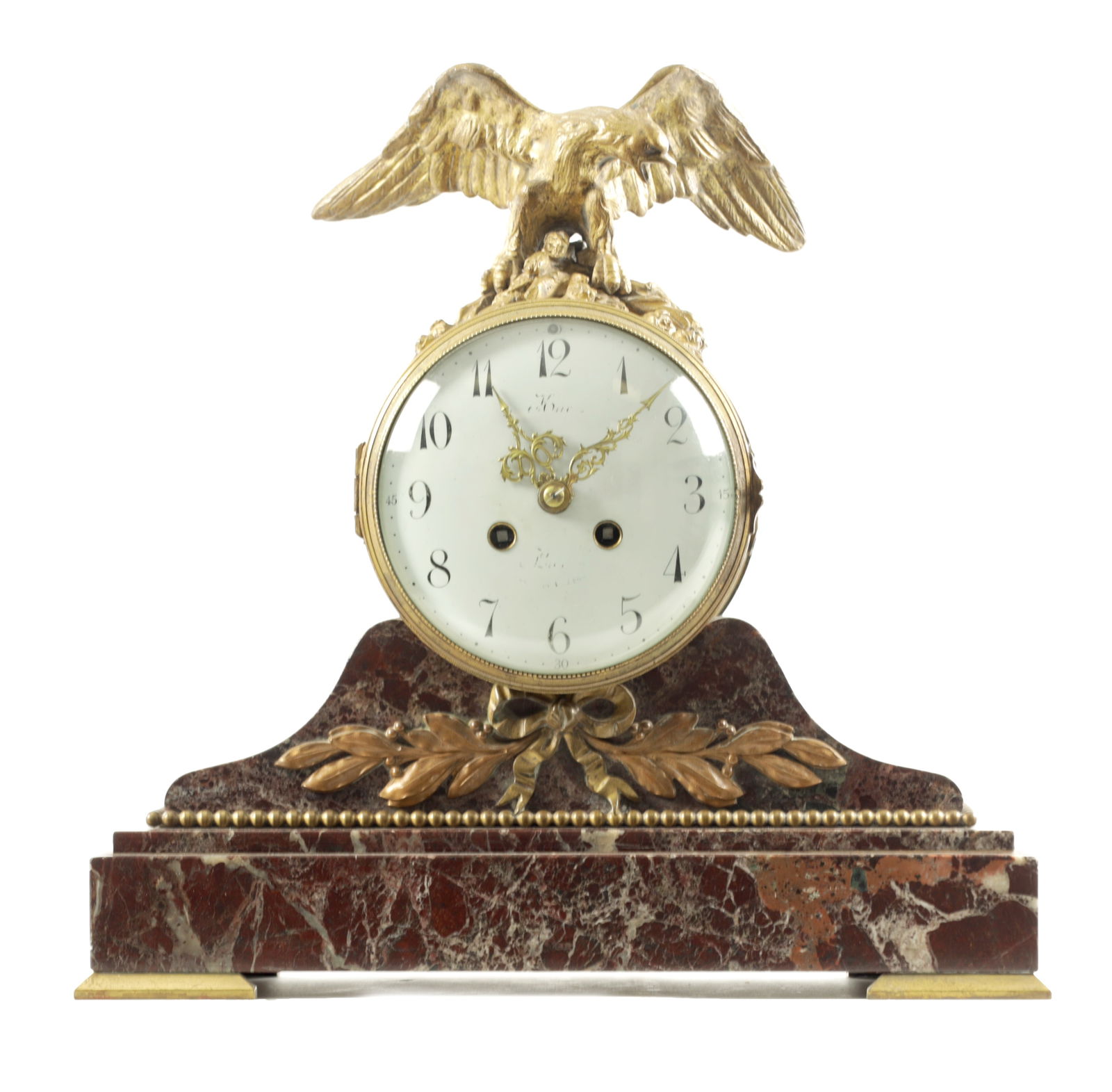 A 19TH CENTURY FRENCH ORMOLU AND VEINED MARBLE MANTEL CLOCK: A 19TH CENTURY FRENCH ORMOLU AND VEINED MARBLE MANTEL CLOCK with eagle surmount above a convex enamelled dial having arabic numerals, fronting an eight-day French spring-driven movement striking the h