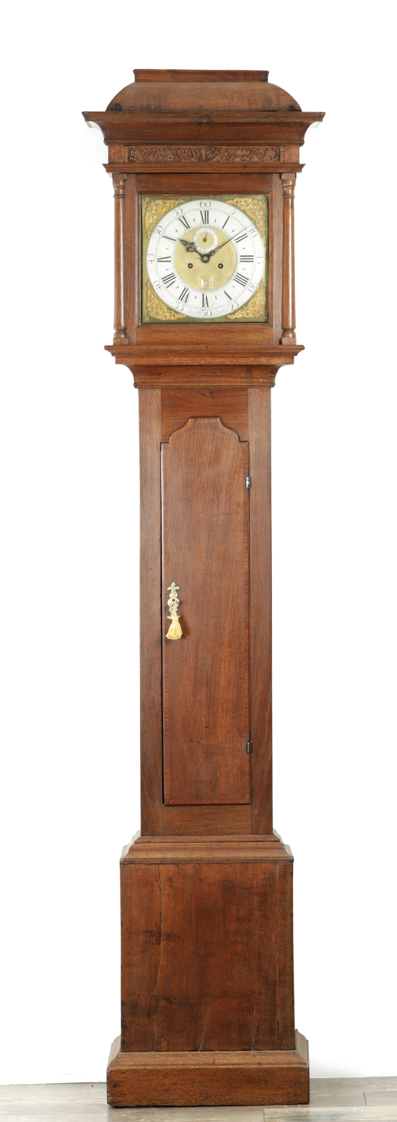 SMITH, CHESTER. A MID 18TH CENTURY OAK EIGHT DAY LONGCASE CLOCK: SMITH, CHESTER. A MID 18TH CENTURY OAK EIGHT DAY LONGCASE CLOCK, the slender case with caddy top pediment and crossbanded door enclosing a 10 3/4" square gilt brass dial with cherub and crown spandrel